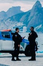 Police watch over tourists in Arpoador, Rio de Janeiro, Brazil. Rio is a popular tourist city but also experiences high levels of