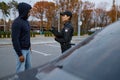 Police woman officer issuing fine to offender