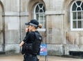 A police woman outside Buckingham Palace