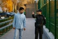 Police woman showing way to man passerby Royalty Free Stock Photo