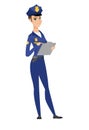 Police woman in uniform writing on clipboard. Royalty Free Stock Photo