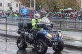 Police worker is riding atv on military parade