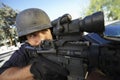 Policeman Aiming With Gun Outdoors