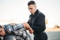 Policeman arrests the car thief on road