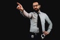 Policeman with beard wearing eyeglasses and policeman badge showing and pointing with finger Royalty Free Stock Photo