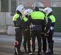 Policeman with biker clothes while controlling city traffic