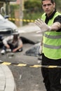 Policeman at car accident area Royalty Free Stock Photo