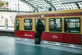 Berlin, October 03, 2017: A policeman with the chieftain goes to the train to leave. Demobilization, vacation. Ride by Royalty Free Stock Photo