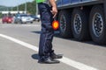 Policeman controlling traffic on the highway Royalty Free Stock Photo