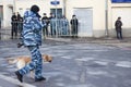 Policeman with a dog on the opposition action Royalty Free Stock Photo