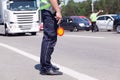 Police officer controlling traffic on the highway Royalty Free Stock Photo
