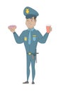 Policeman eating doughnut and drinking coffee.