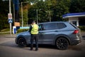 Policeman fined for parking violation. parking attendant, traffic warden, getting parking ticket