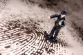 Policeman on giant fingerprint