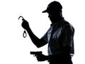 Policeman holding handcuffs and handgun Royalty Free Stock Photo