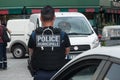 Policeman keeps a security perimeter after a building fire