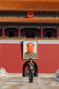 Policeman and Mao's portrait