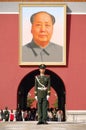 Policeman and Mao's portrait