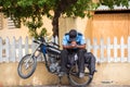 A policeman on a motorcycle on a city street, Santo Domingo, Dominican Republic. Copy space for text.