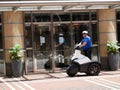 Policeman patrol the streets on electric scooter