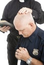 Policeman in Prayer Royalty Free Stock Photo