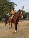 A policeman riding a horse in a park