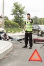Policeman at road accident scene Royalty Free Stock Photo