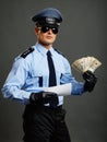 Policeman shows money and document