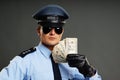 Policeman shows money