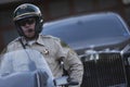 Policeman Sitting On Motorbike With Car In Background Royalty Free Stock Photo