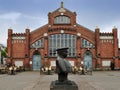 The Policeman statue (Toripolliisi) and the Market Hall on Market Square, Oulu, Finland Royalty Free Stock Photo