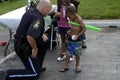 Policeman talking to a small child