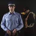 Policeman and thief. Robbery scene. Royalty Free Stock Photo