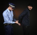 Policeman and thief. Robbery scene. Royalty Free Stock Photo