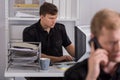 Policeman using computer at work Royalty Free Stock Photo