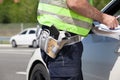 Police officer is writing a speeding ticket Royalty Free Stock Photo