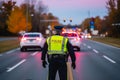 a policeman in a yellow vest keeps order on the road, rear view generative ai