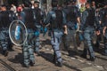 Policemen follow the Mayday parade in Milan, Italy