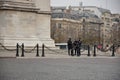 Policemen in front of the Arc de Triomphe de l'Etoile in Paris, France