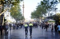 Policemen patrolling La Rambla street, Barcelona