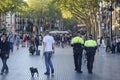 Policemen patrolling La Rambla street, Barcelona