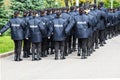 The policemen in uniform with the inscription Police in Ukrainian, goes along the street in Dnipro city Ukraine