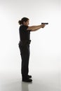 Policewoman aiming gun.