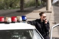 policewoman talking by radio set