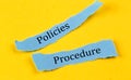 POLICIES PROCEDURE text on a blue pieces of paper on yellow background, business concept Royalty Free Stock Photo