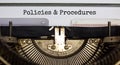 Policies and procedures symbol. Words `Policies and procedures` typed on retro typewriter. Business and policies and procedures