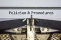 Policies and procedures symbol. Words `Policies and procedures` typed on retro typewriter. Business and policies and procedures