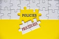 Policies and procedures text on missing jigsaw puzzle. Business policies concept Royalty Free Stock Photo