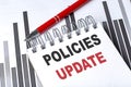 Policies Update text written on notebook with pen on chart Royalty Free Stock Photo