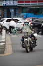 Policeman on his motorbike near Narrow alleys of Changshun Street, Qingyang District, Chengdu Royalty Free Stock Photo